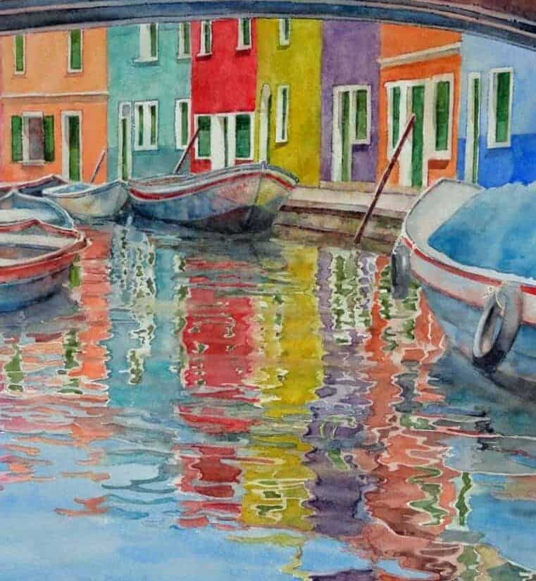 Watercolor painting by Cindy Briggs of colorful Burano houses and boats reflected in a canal