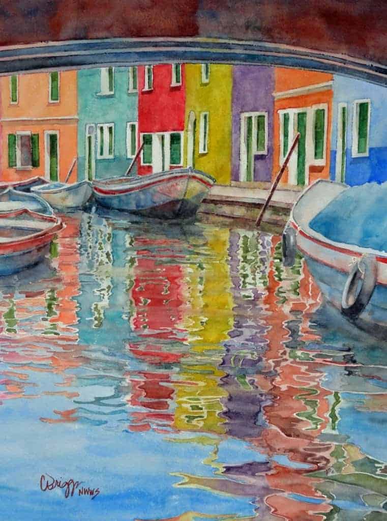 Watercolor painting by Cindy Briggs of colorful Burano houses and boats reflected in a canal
