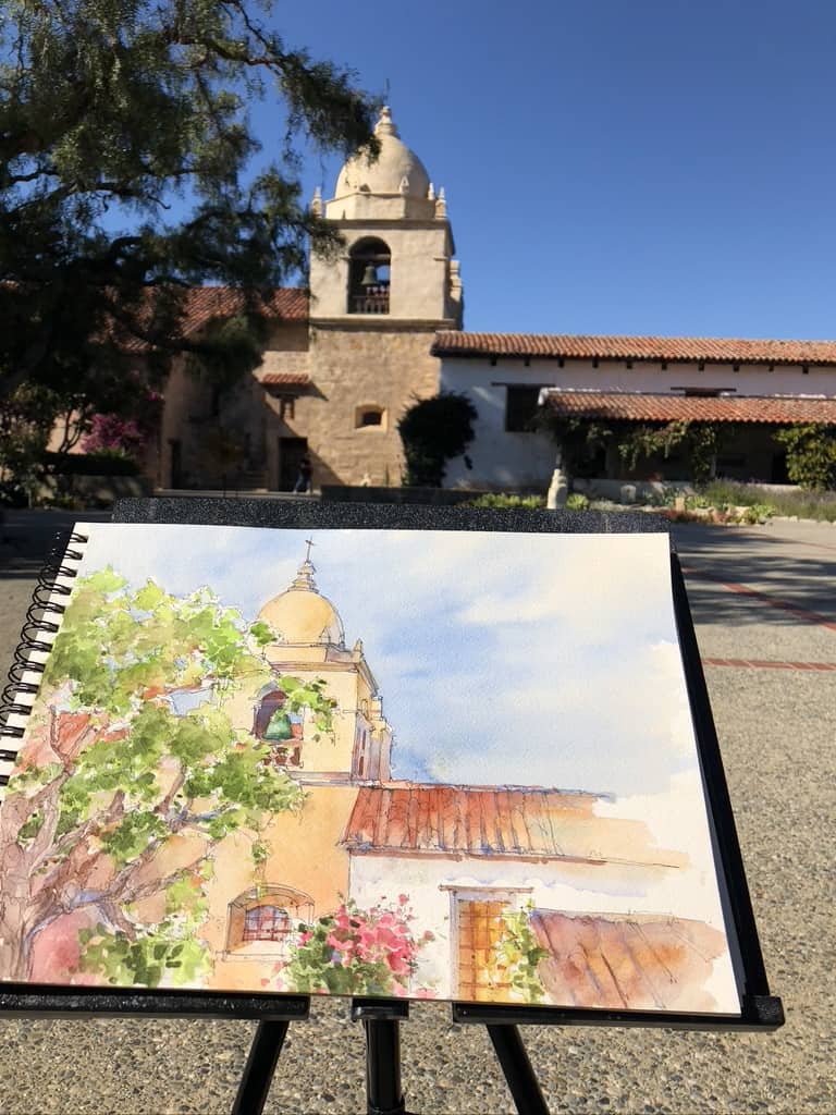 What is challenging about painting outdoors?