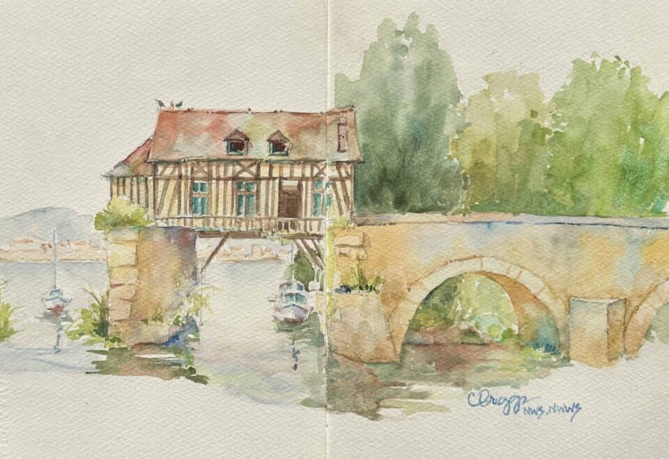 Watercolor painting by Cindy Briggs of a half-timbered house beside a stone bridge over a river