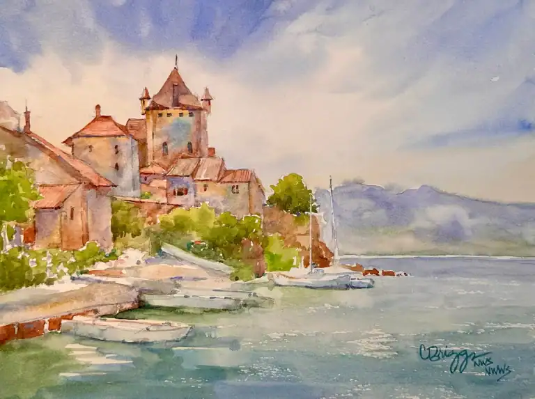 Watercolor painting of a castle by the water with boats and lush greenery.