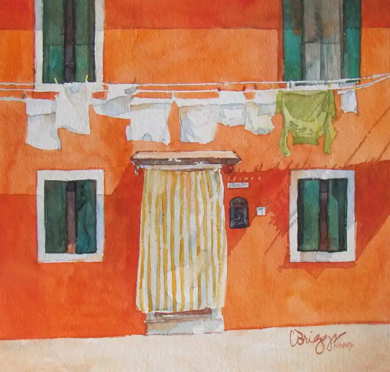 Colorful watercolor painting of an orange building with laundry hanging outside.